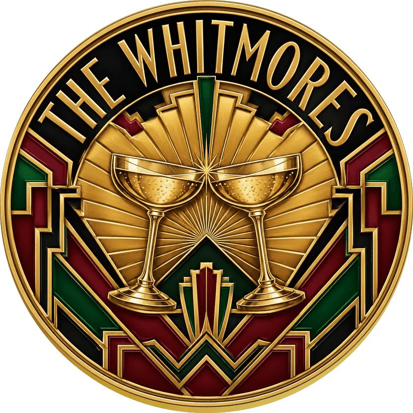 Gold Art Deco wedding coin with champagne coupes at the centre of a golden sunburst over black and emerald lacquer panels, reading THE WHITMORES